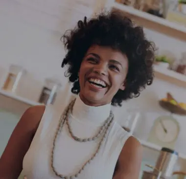 A woman smiling in her shop
