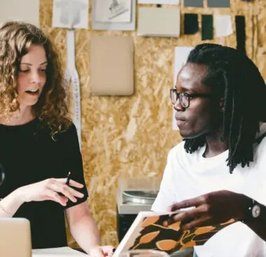 Two people working in their workshop