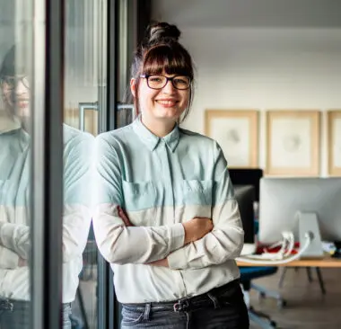 woman writing at her desk