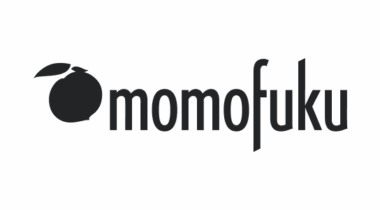 Momofuku logo with a stylised fruit graphic on the left.
